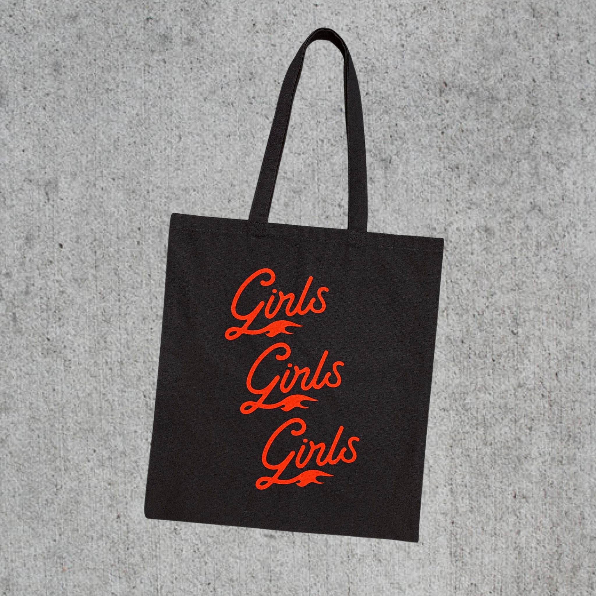 Black tote bag with the words “Girls Girls Girls” in red