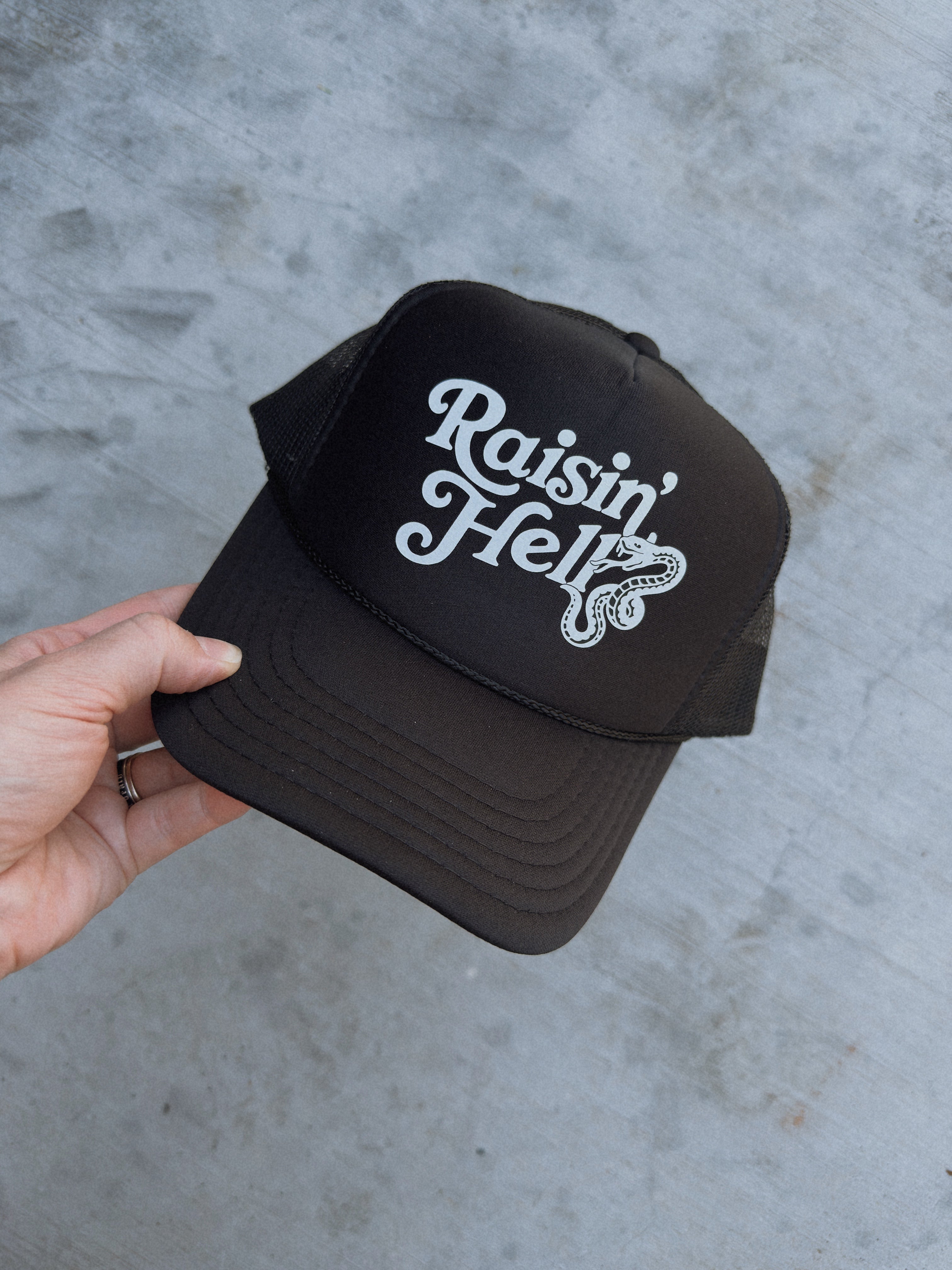 Raisin’ Hell Trucker Hat